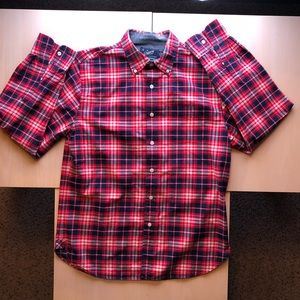 Checkered red/navy blue button down shirt.